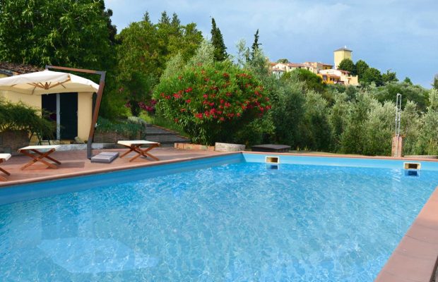 Pool with sunbeds and views