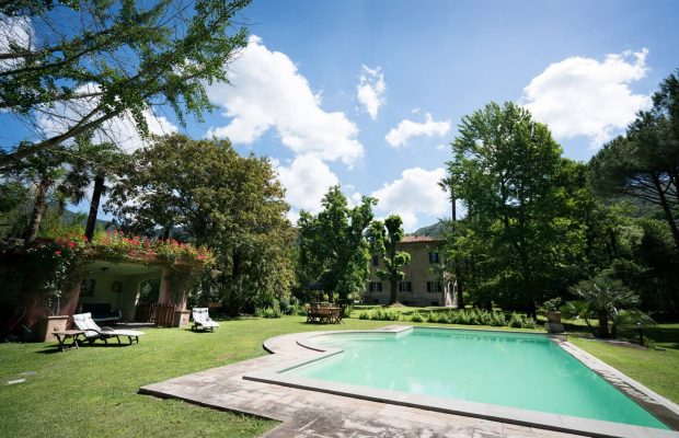 Pool side with covered seating area